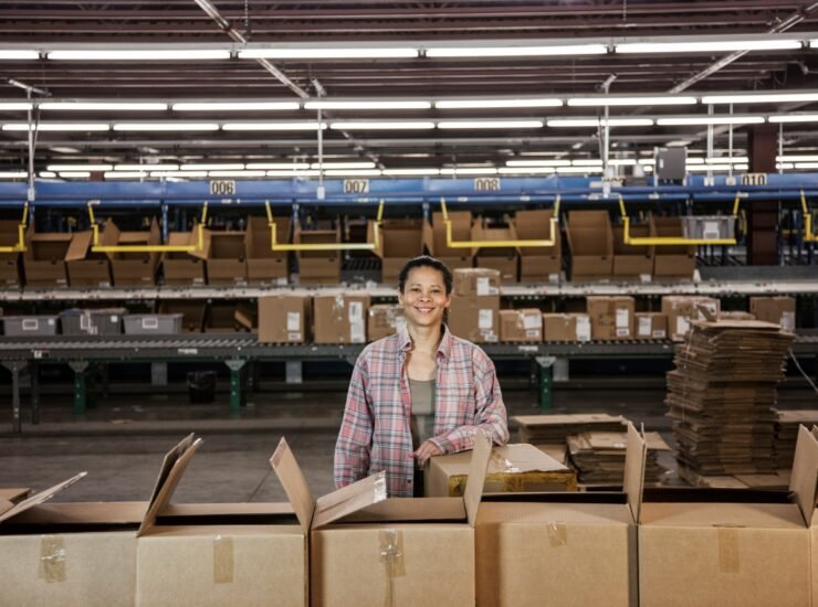 Portrait of an African American female warehouse worker in a large distribution warehouse with